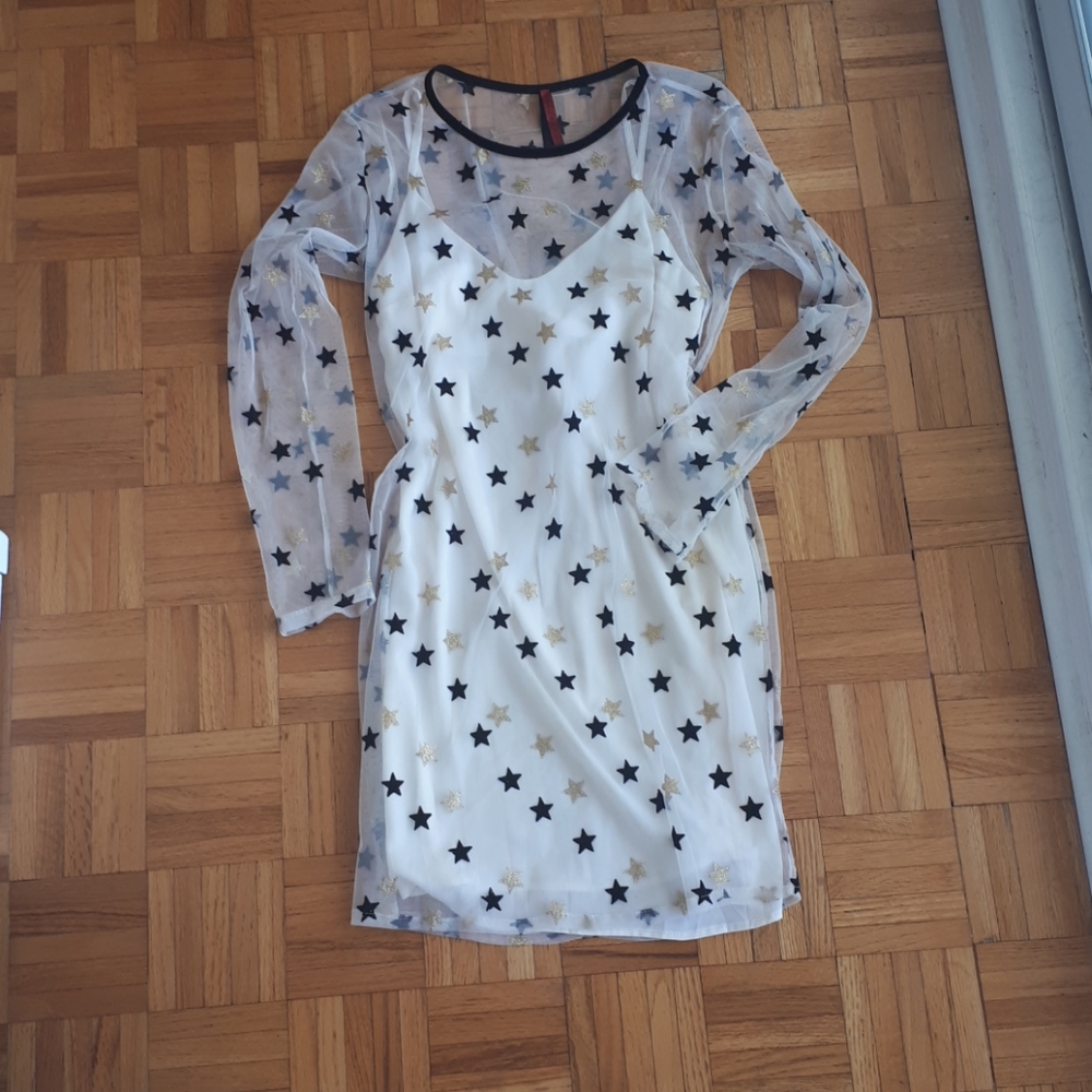 White sheer dress with gold and black stars